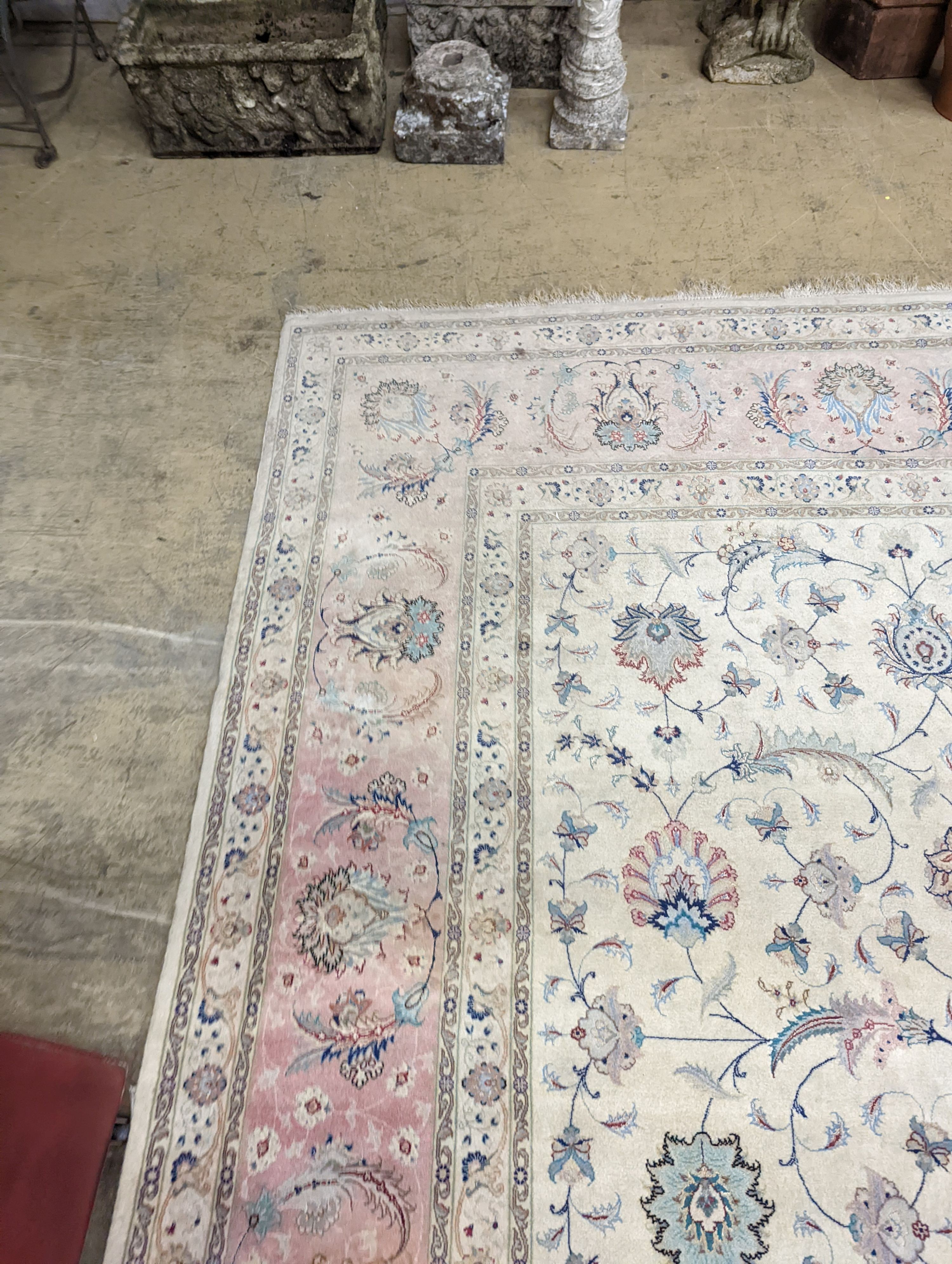 A Persian Tabriz ivory ground carpet, 410 x 300cm